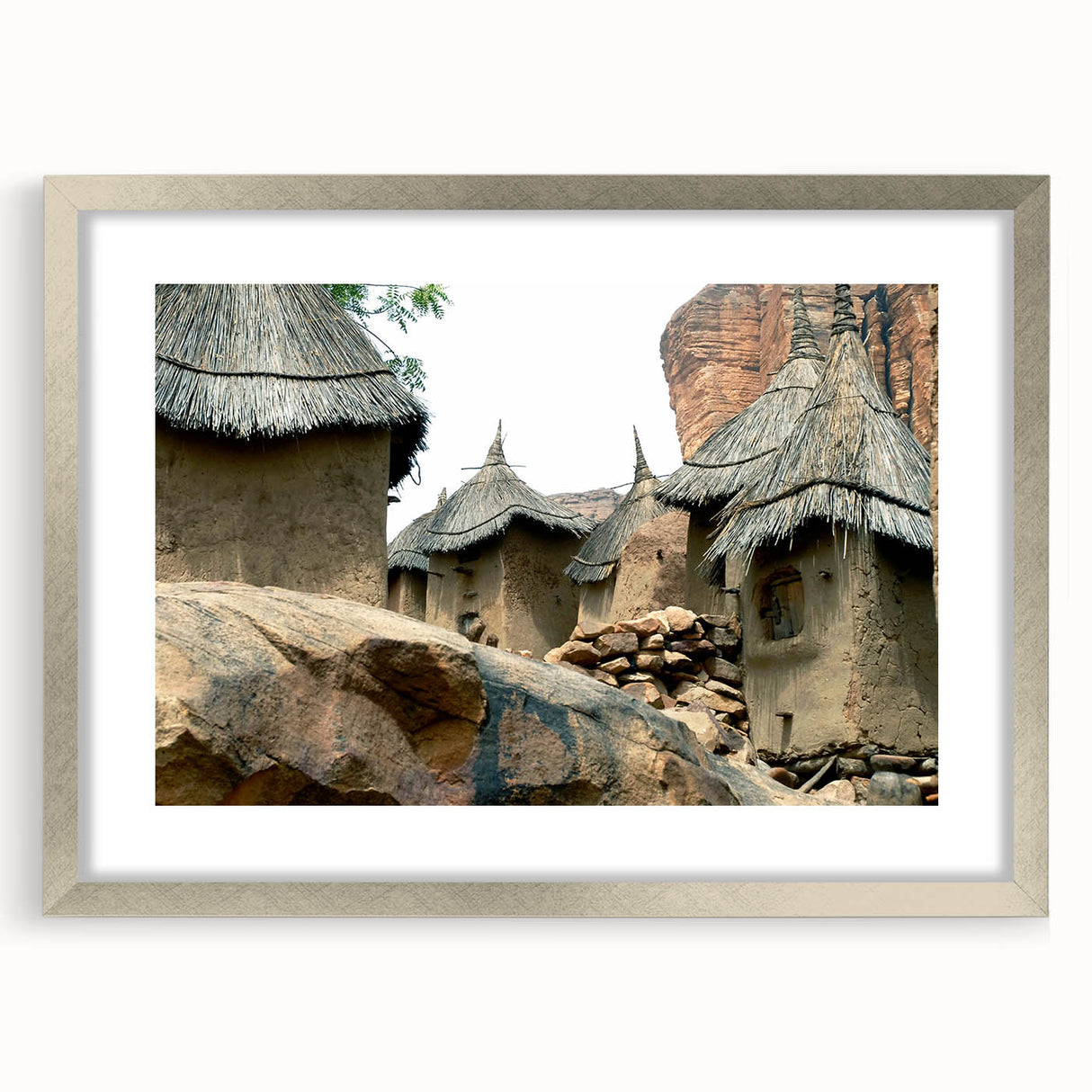 Abstract art print of African scenery in muted earth tones on a framed silver mat, ideal for dining room decor.