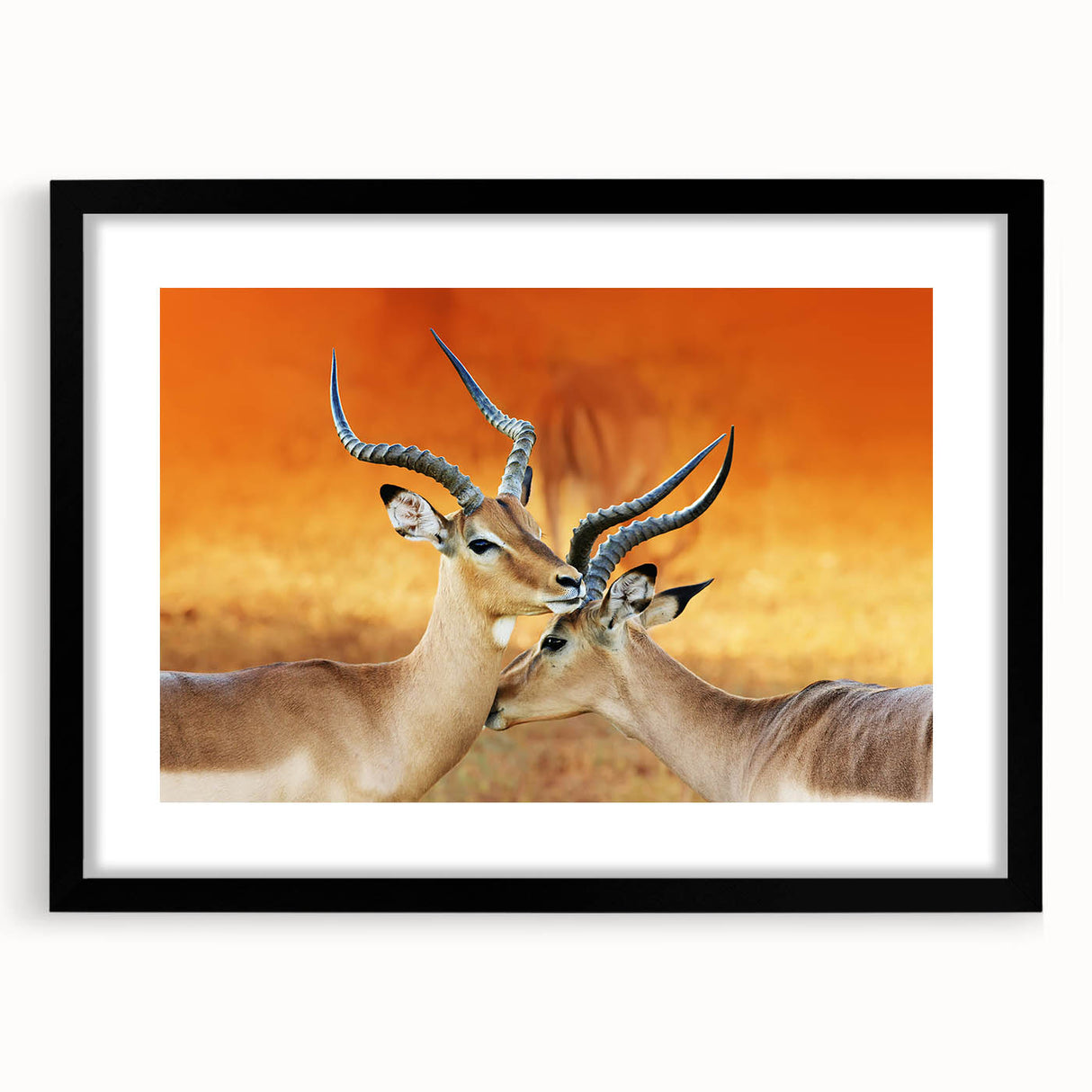 Colorful abstract art print of an African scenery in vibrant hues, framed in black, ideal for living room decor.