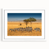 Abstract art print of Tanzanian scenery in muted earth tones, framed with a white mat, suitable for dining room decor.