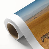 Art deco poster of a serene Tanzanian landscape in soft earth tones on rolled canvas, ideal for nursery wall art.
