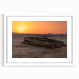 Textured abstract art print of Tunisian scenery in muted earth tones, framed with a white mat, ideal for bedroom art.