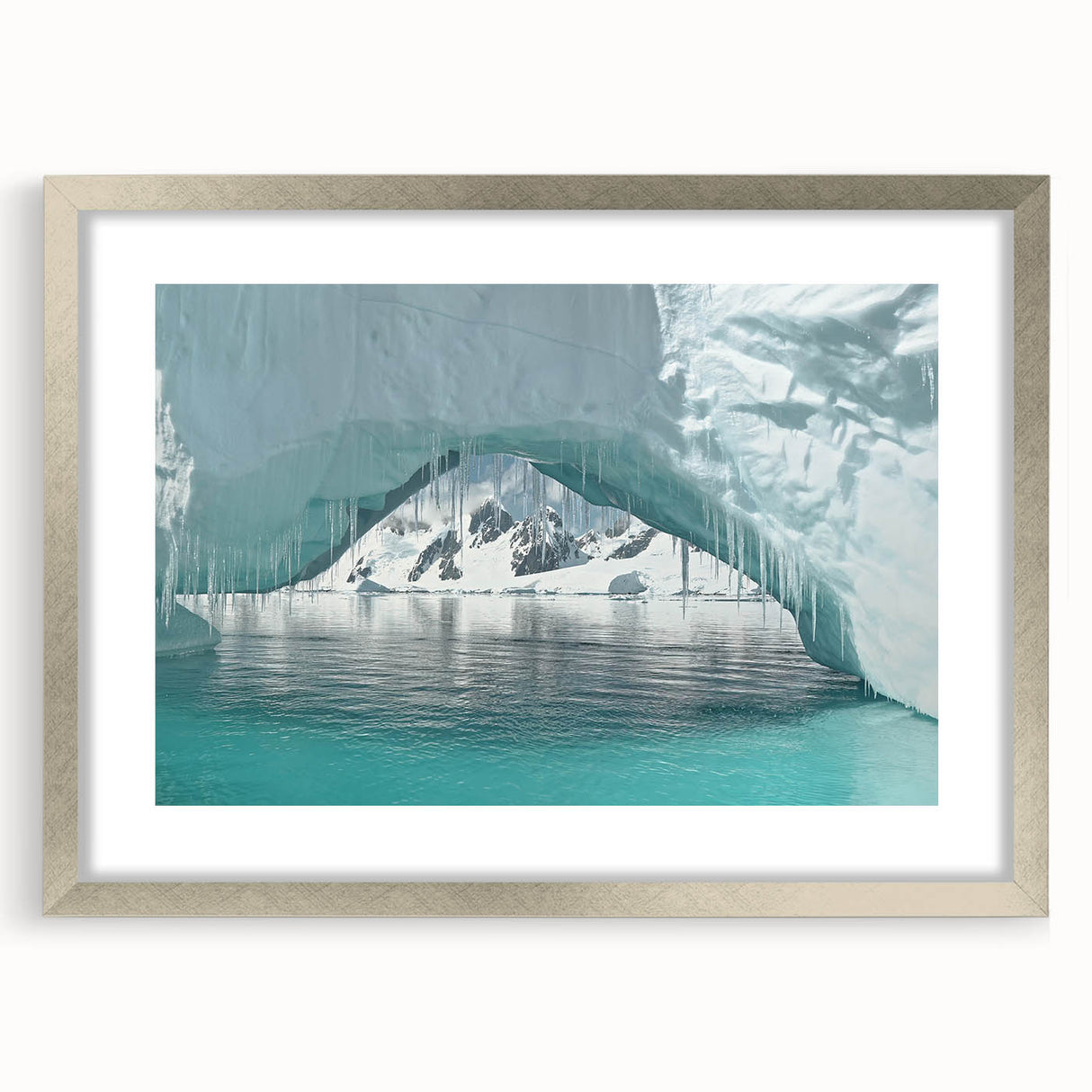 Textured abstract art print of an Antarctic landscape in muted blue and white tones, framed in silver.