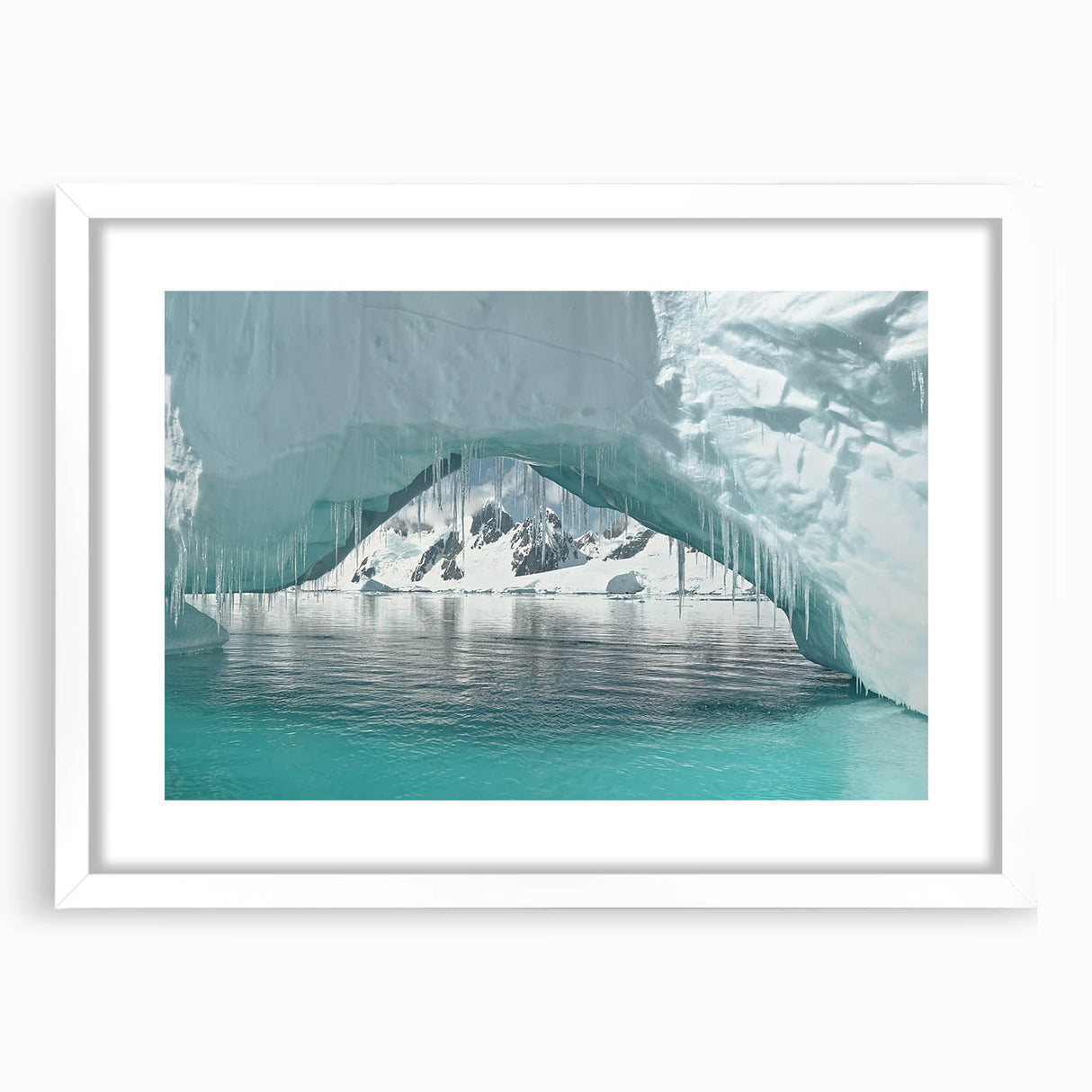 Abstract art print of an Antarctic landscape in muted gray and blue tones, framed with a white mat.