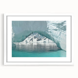 Abstract art print of an Antarctic landscape in muted gray and blue tones, framed with a white mat.
