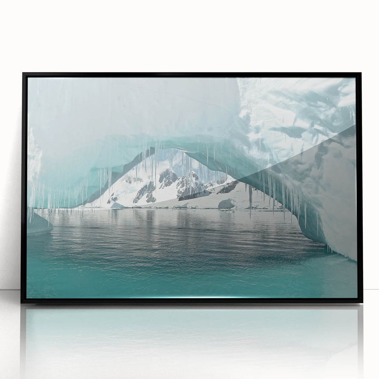 Large abstract wall art depicting an icy Antarctic landscape in muted blue and white tones, framed in black acrylic.