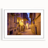 Abstract art print featuring geometric shapes in muted blue and beige tones on a white framed canvas.