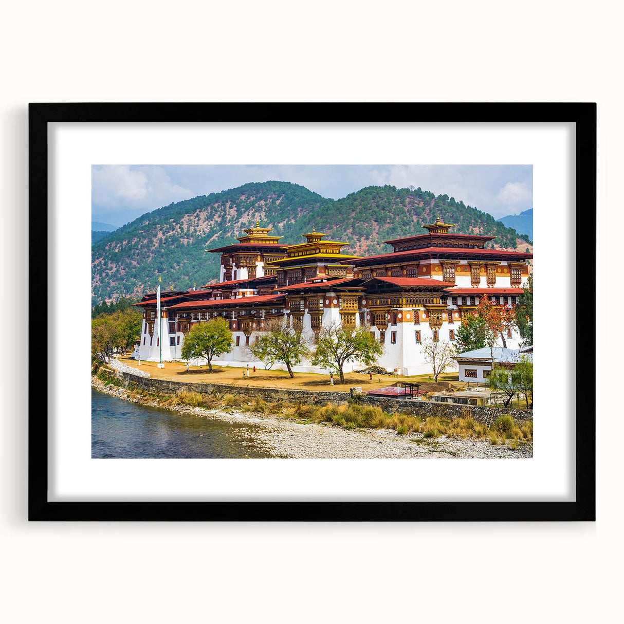 Extra large abstract art print featuring a colorful, textured scenery of Bhutan, in a black frame.