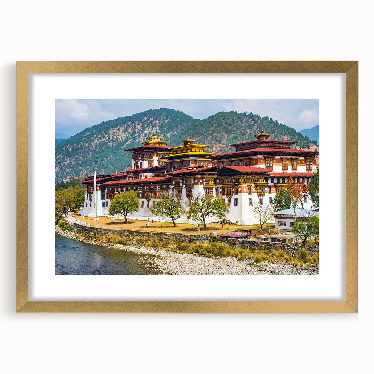Extra large abstract art print of a Bhutanese landscape in textured gold frame, ideal for living room decor.