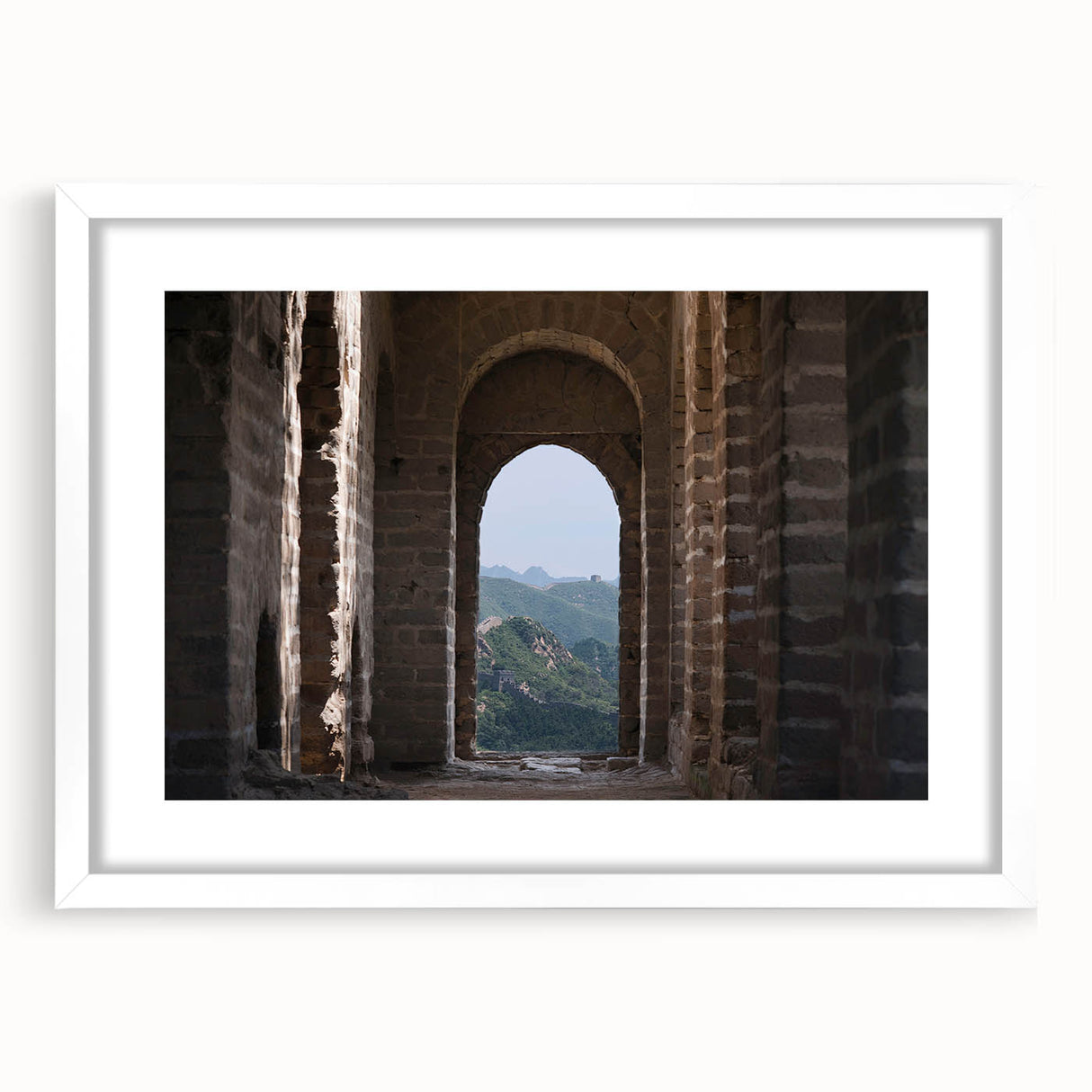 Abstract art print of the Great Wall of China in muted earth tones, framed in white, ideal for dining room decor.