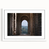Abstract art print of the Great Wall of China in muted earth tones, framed in white, ideal for dining room decor.