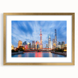 Extra large abstract art print of Shanghai skyline in muted gold and gray tones on a textured canvas, framed.