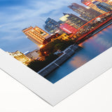 Art deco poster of Shanghai skyline in muted gold and black, on rolled canvas, suited for dining room wall.