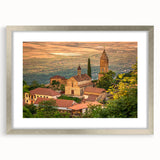 Textured abstract art print featuring muted earth tones in a silver frame, ideal for bedroom wall decor.