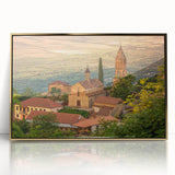 Large acrylic print of a mid-century modernist Georgian landscape, with muted earth tones, framed in gold.