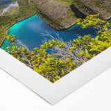 Art deco poster of an Indonesian landscape on rolled canvas, featuring muted earth tones, ideal for dining room decor.