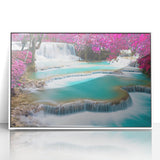 Art deco poster of a Laos scenery in muted green and blue tones, acrylic print framed in white.