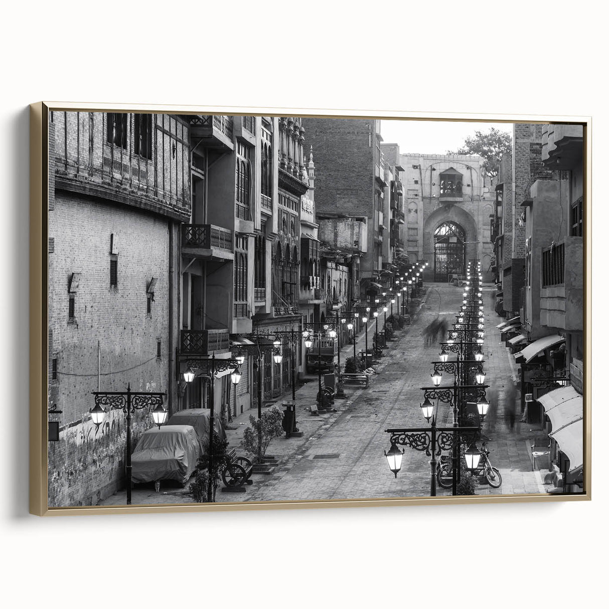 Framed canvas depicting a vintage-style Pakistani landscape in muted gold and black tones, ideal for bedroom wall decor.