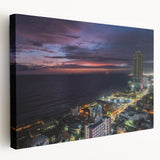 Side view of a stretched canvas depicting a serene Sri Lankan landscape in muted green and blue tones.