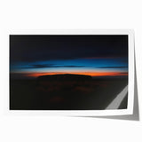 Ayers Rock landscape on rolled print, featuring earthy red and orange tones, suitable for dining room wall art.
