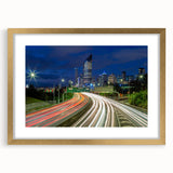Textured art depicting an abstract Brisbane skyline in muted gray and blue tones, framed with a gold mat.