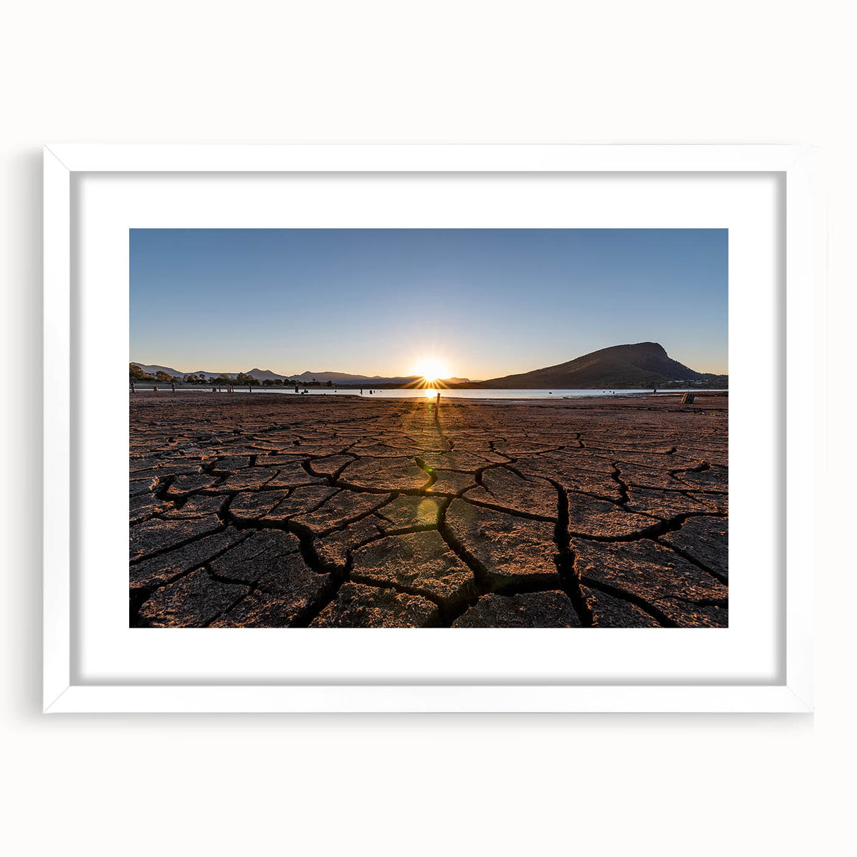 Textured abstract art print depicting Queensland scenery in muted earth tones on a framed white canvas.