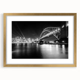 Abstract art print of Sydney skyline in muted gold and blue tones, framed with a gold mat, suitable for dining room decor.