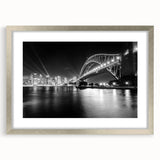 Extra large abstract art print of Sydney scenery, featuring textured strokes in cool blues and grays, framed in silver.