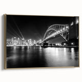Framed canvas featuring a vintage-style landscape painting of the Sydney skyline, dominated by black and gold tones.