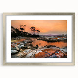 Abstract art print depicting a Tasmanian landscape in muted earth tones, framed in silver.
