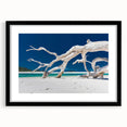 Abstract art print featuring vibrant, colorful textures on a large canvas, framed in black, ideal for living room decor.