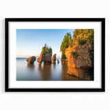 Abstract art print of a colorful, textured landscape, in a black frame with mat, ideal for living room decor.