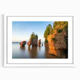Abstract art print of New Brunswick scenery in muted earth tones on a framed white mat, suitable for dining room decor.