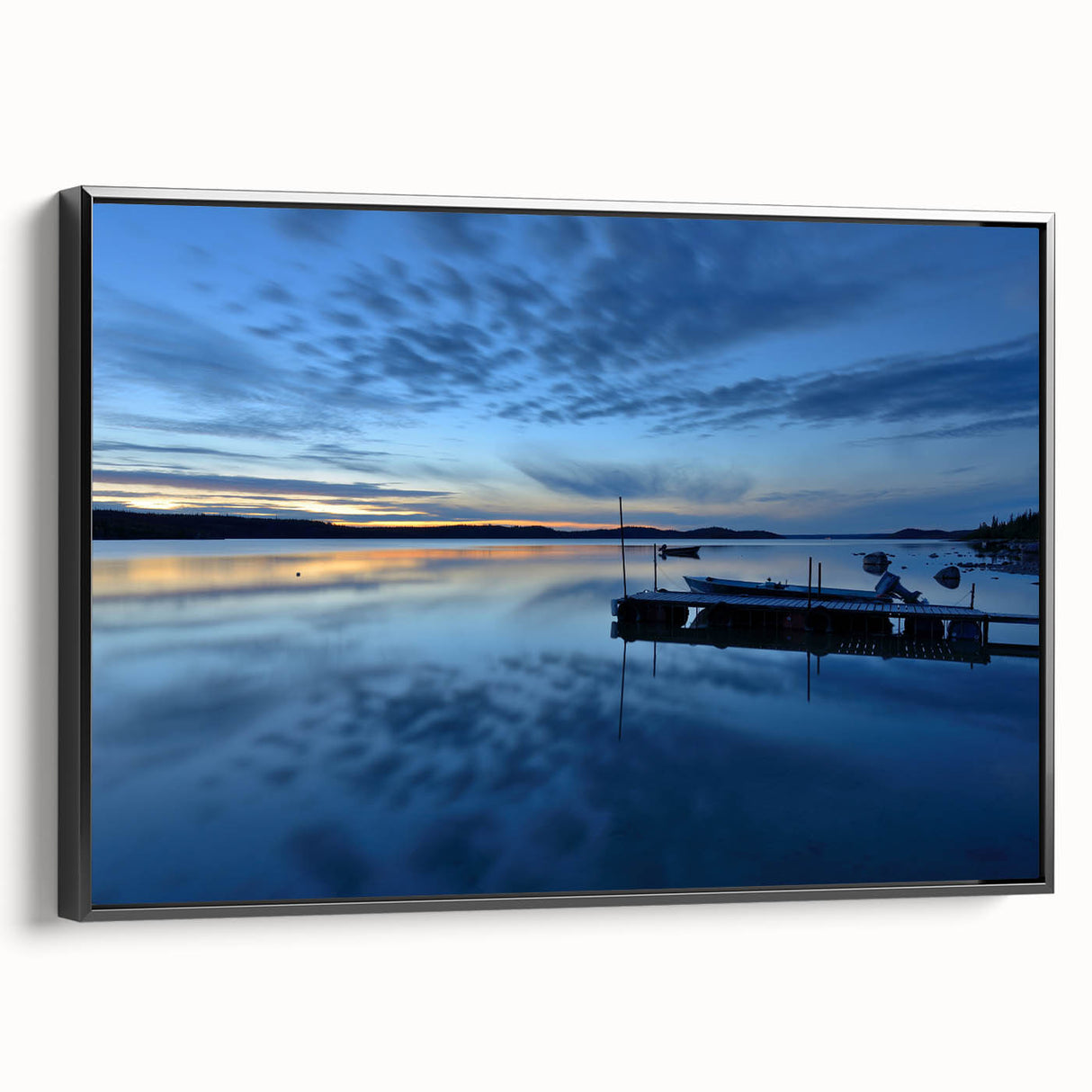 Black and white wall art featuring a vintage poster-style landscape of the Northwest Territories on a framed canvas.