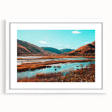 Abstract art print of Nova Scotia scenery in muted blue and green tones, framed with a white mat.