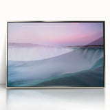 Mid-century modernist art depicting Ontario scenery in muted green and blue hues, framed in silver acrylic.