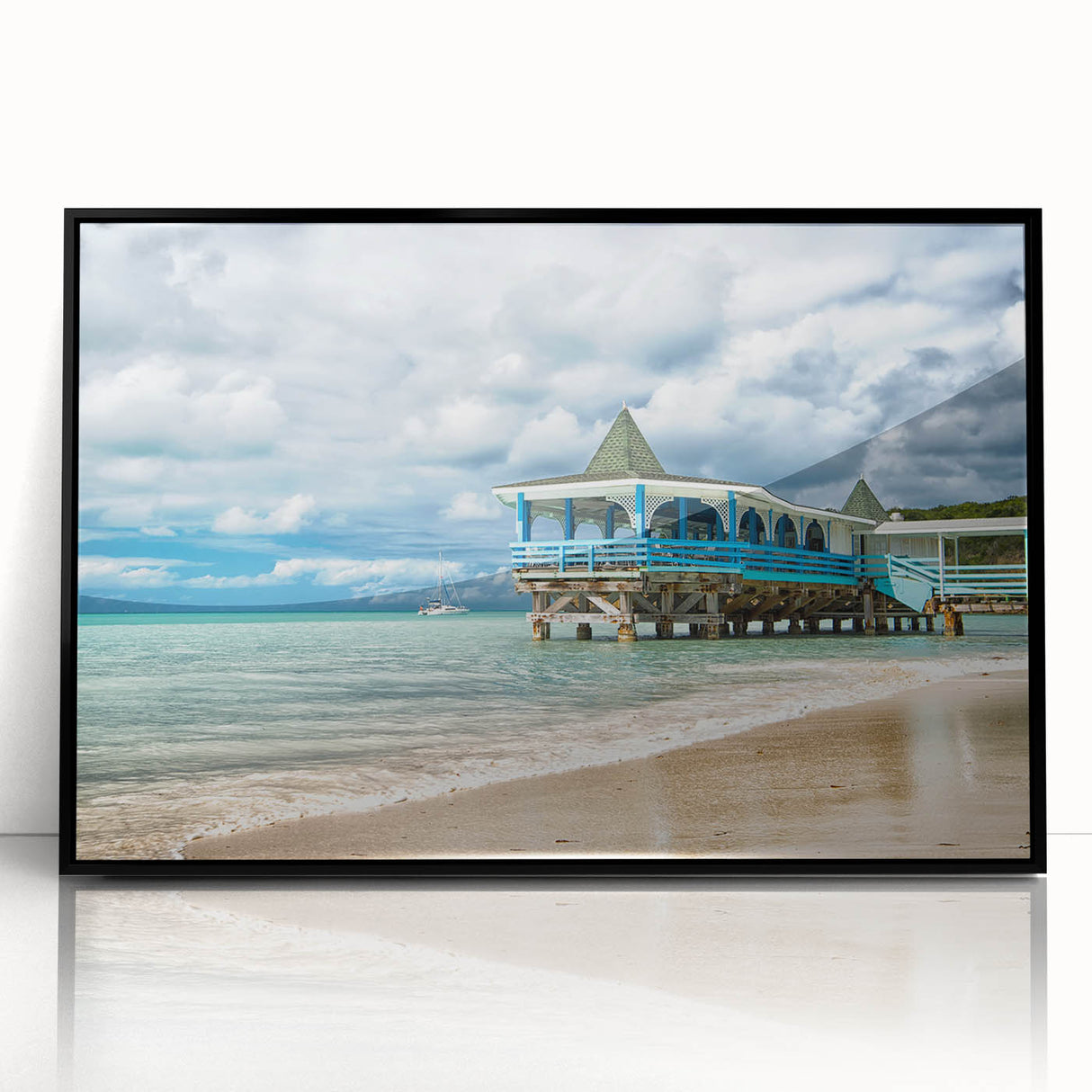 Large abstract wall art depicting a Caribbean scene in vibrant blue and green tones, framed in black acrylic.