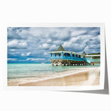 Extra large rolled print of a Caribbean Antigua scenery with vibrant ocean and floral elements.