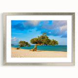 Extra large abstract art print depicting a textured Caribbean scenery in blue and turquoise, framed in silver.