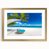 Abstract art print of a Caribbean scenery in muted blue and green tones, framed in gold, suitable for dining room decor.