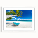 Textured abstract art print of Caribbean scenery in muted blue and white tones, framed with a white mat.
