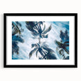 Colorful abstract art print of a Caribbean scenery in a black frame, ideal for living room decor.