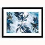 Colorful abstract art print of a Caribbean scenery in a black frame, ideal for living room decor.