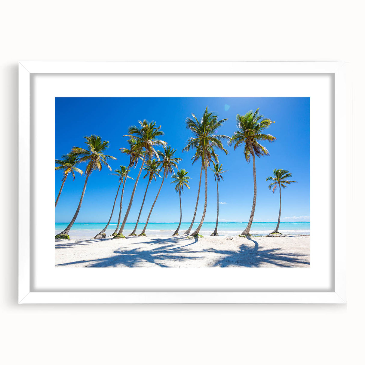 Textured abstract art print depicting Caribbean scenery in muted blue and green tones on a framed white mat.