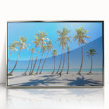 Art deco poster depicting a Caribbean beach scene, framed in silver acrylic, with soft blue and sandy hues.