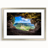 Extra large abstract art print of a Caribbean scene in muted blue and green tones, framed in silver.