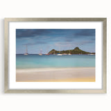 Textured abstract art print of Caribbean Saint Lucia in muted blue tones on a silver-framed mat, suitable for bedroom decor.
