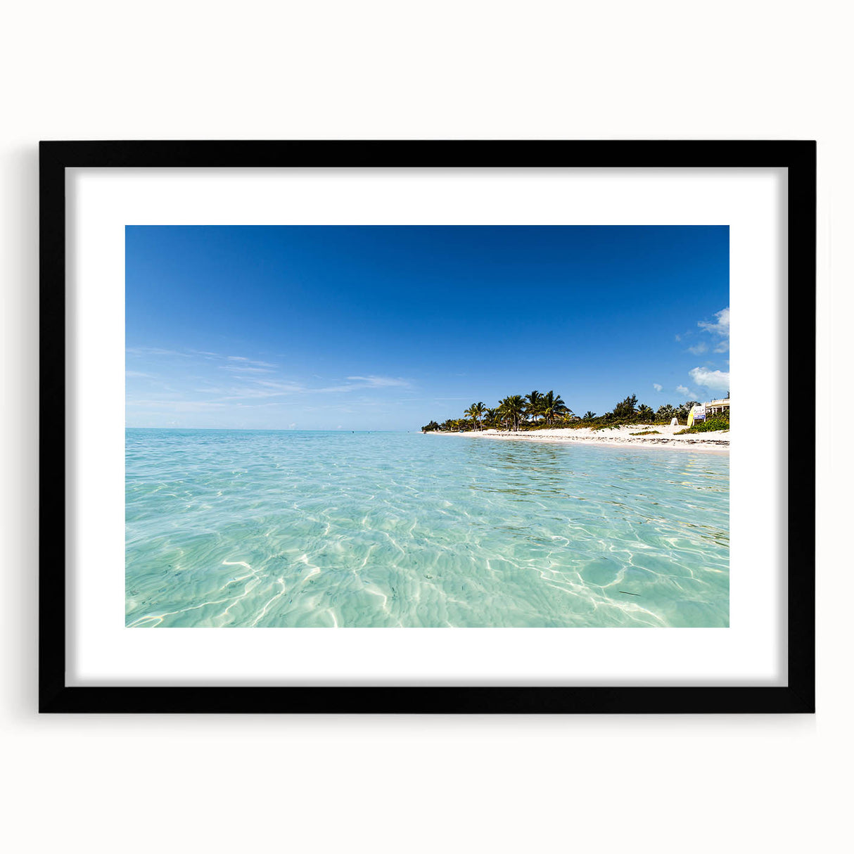 Abstract art print featuring vibrant Caribbean scenery on a textured canvas, framed in black, ideal for living room decor.