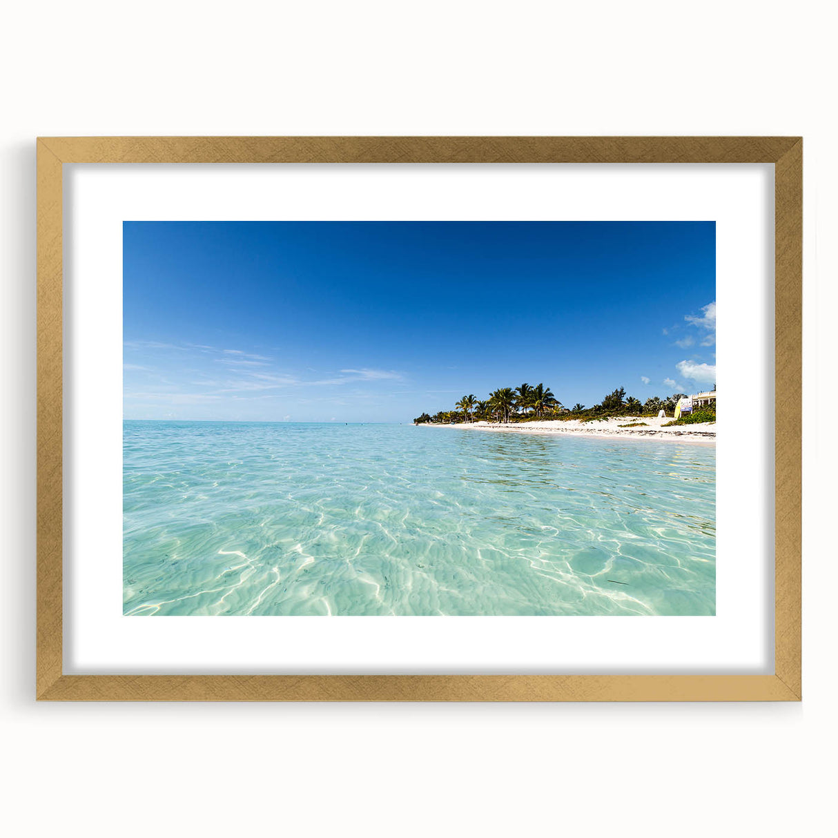 Abstract art print of a Caribbean scene in pastel blue and green, framed in gold, suitable for bedroom or dining room decor.