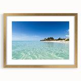 Abstract art print of a Caribbean scene in pastel blue and green, framed in gold, suitable for bedroom or dining room decor.