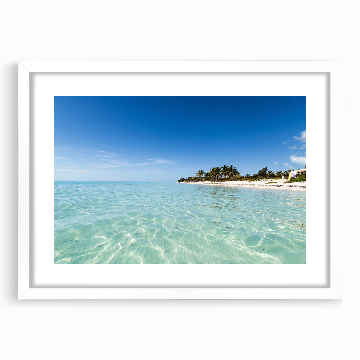 Abstract textured art print depicting a Caribbean seascape in cool blue and white tones on a framed mat.